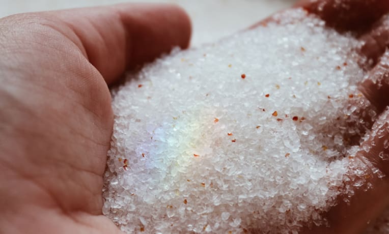 Hand holding minerals