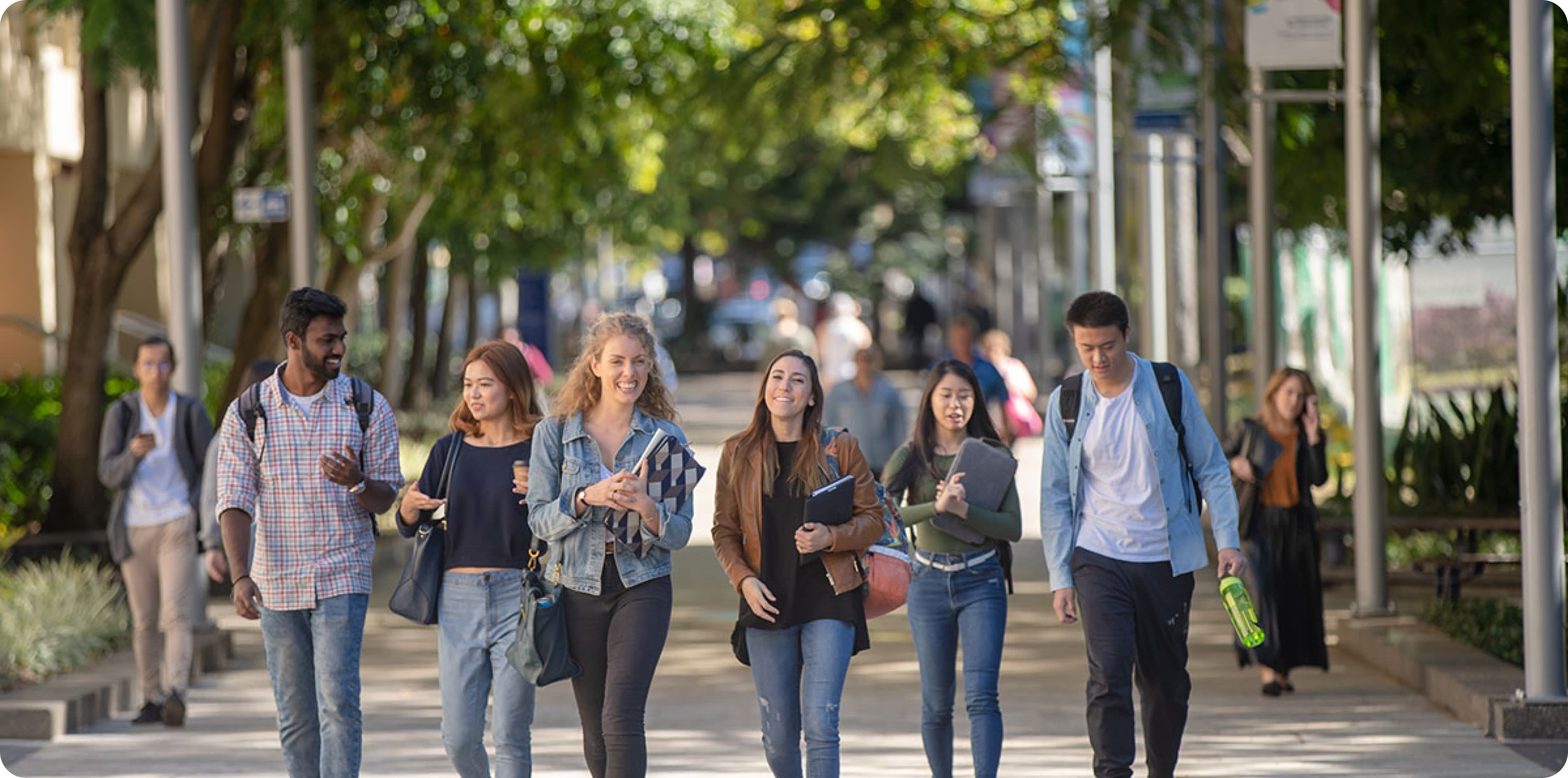 Group of students walking on a footpath