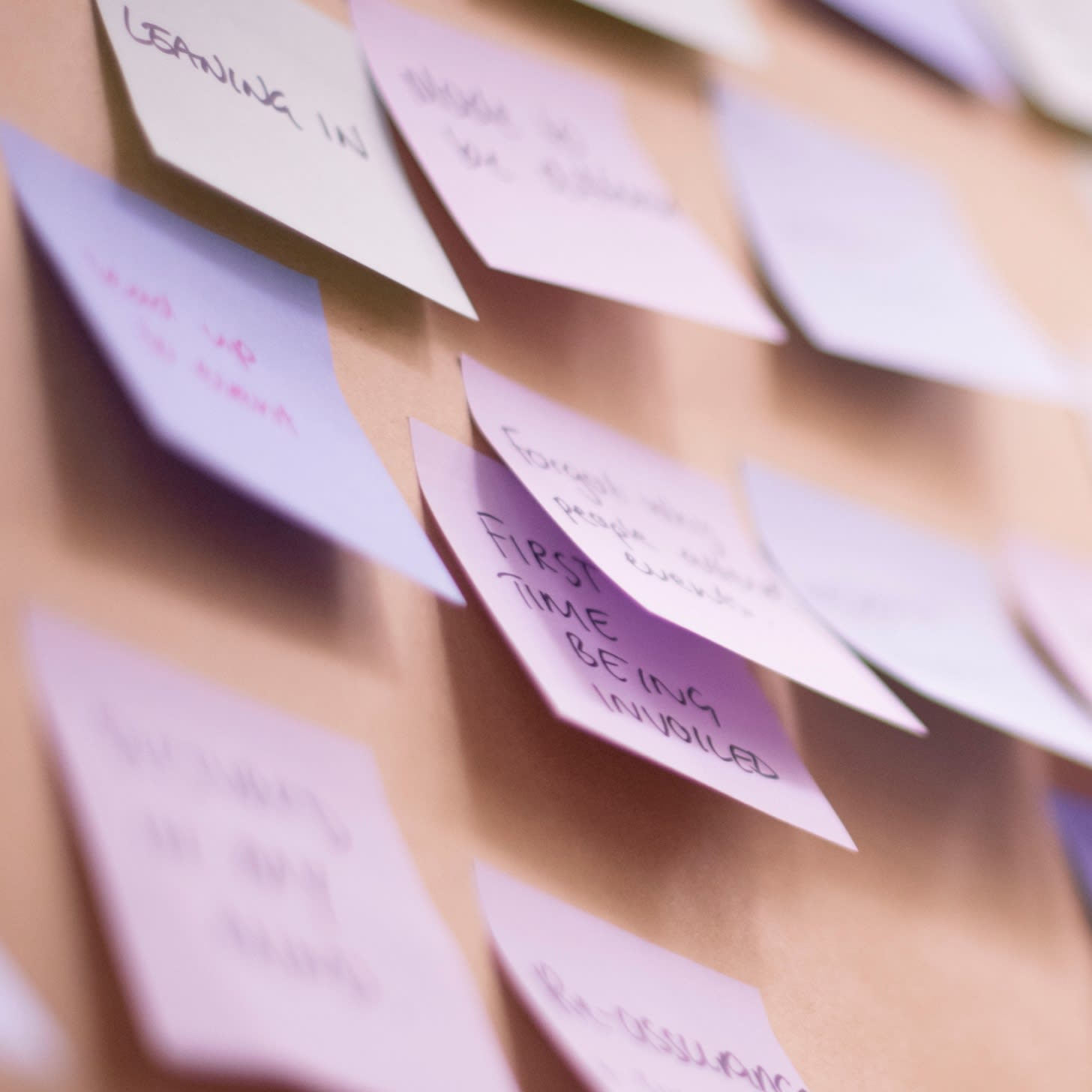 Overlapping sticky notes on a board