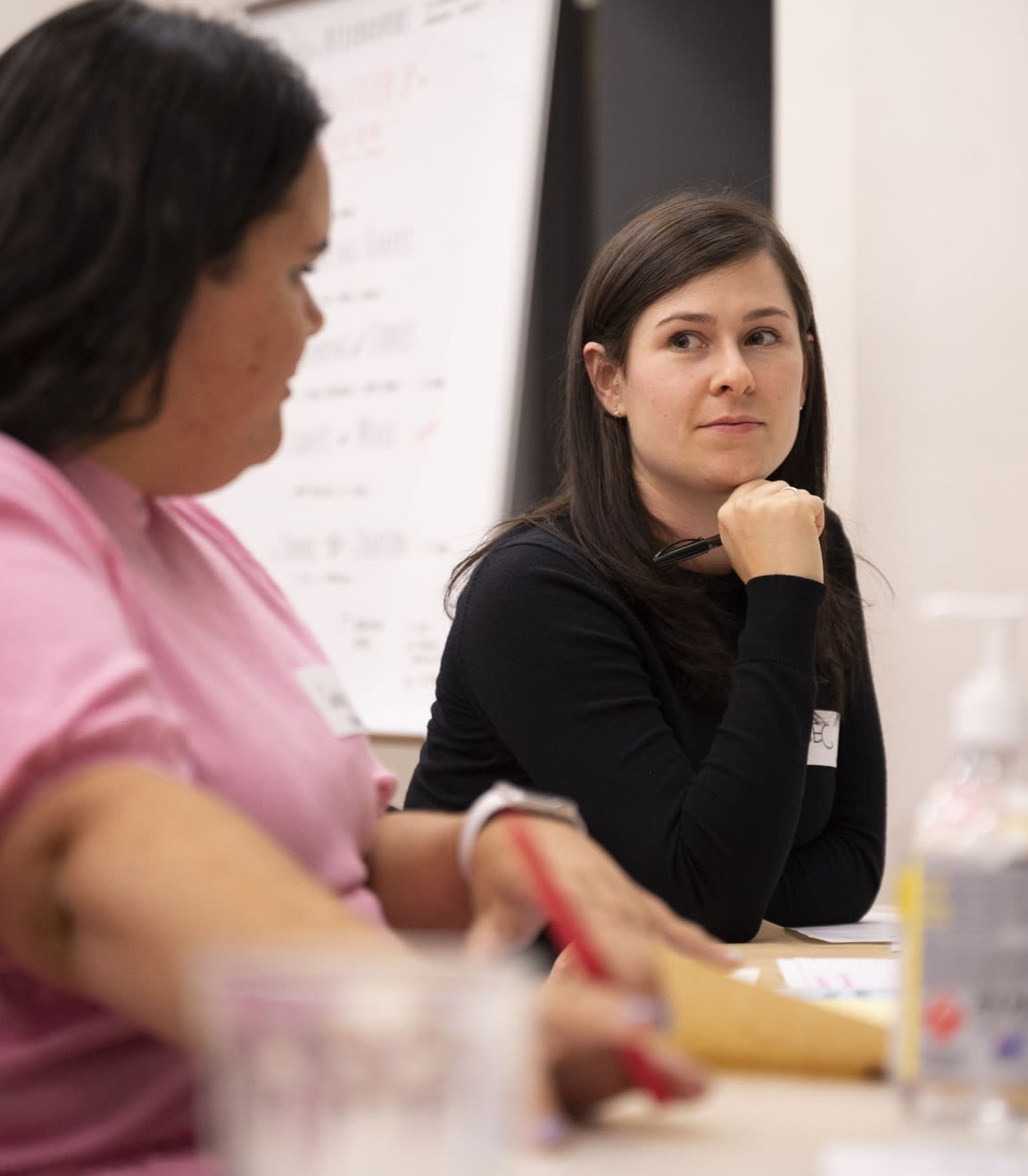 Two people sitting down having a discussion