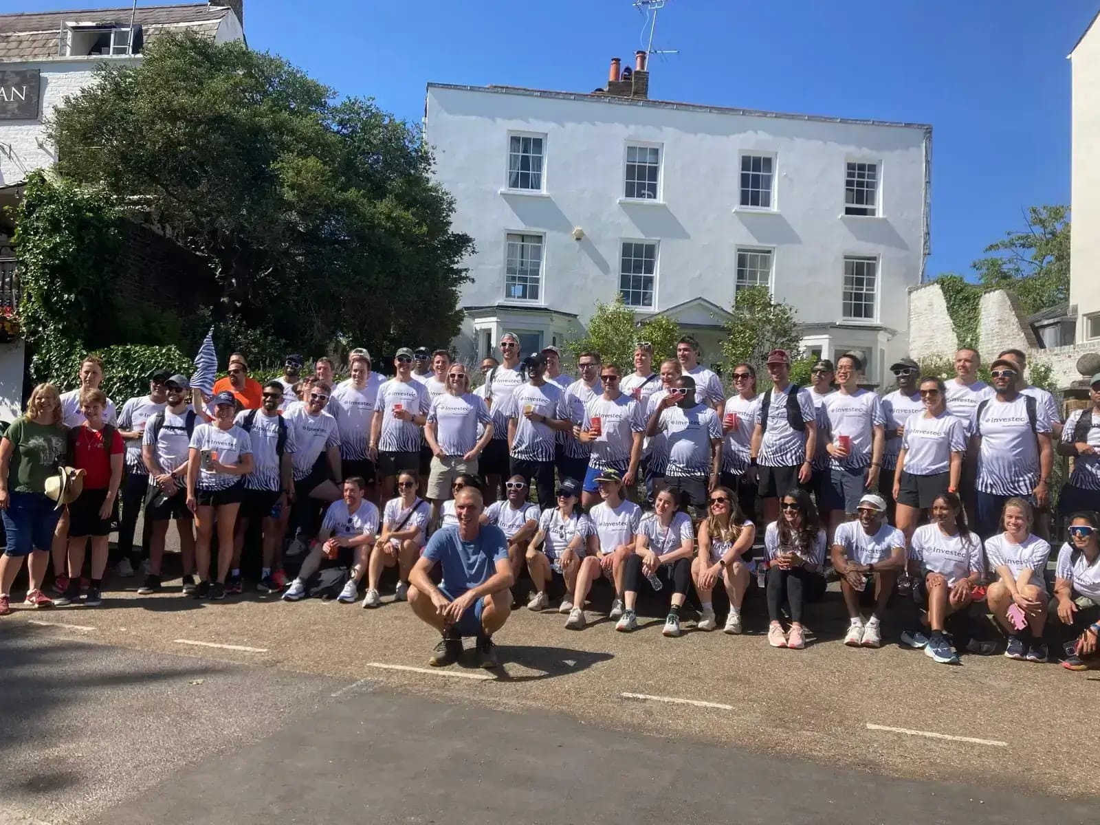 a photograph of myself surrounded by around 70 Investec employees and Lisette and James