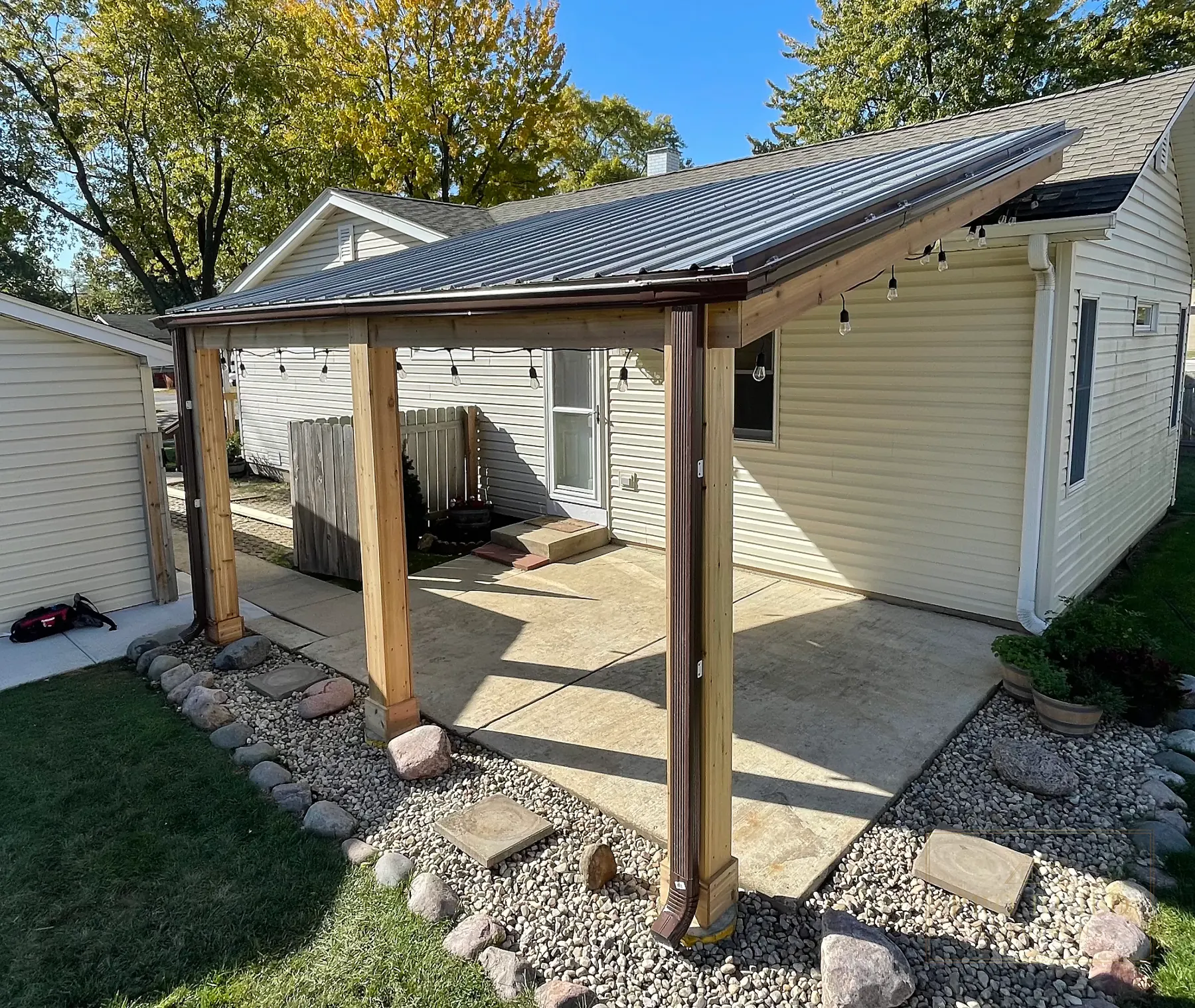 Completed cedar wrapped covered pergola with metal roof in Rolling Meadows