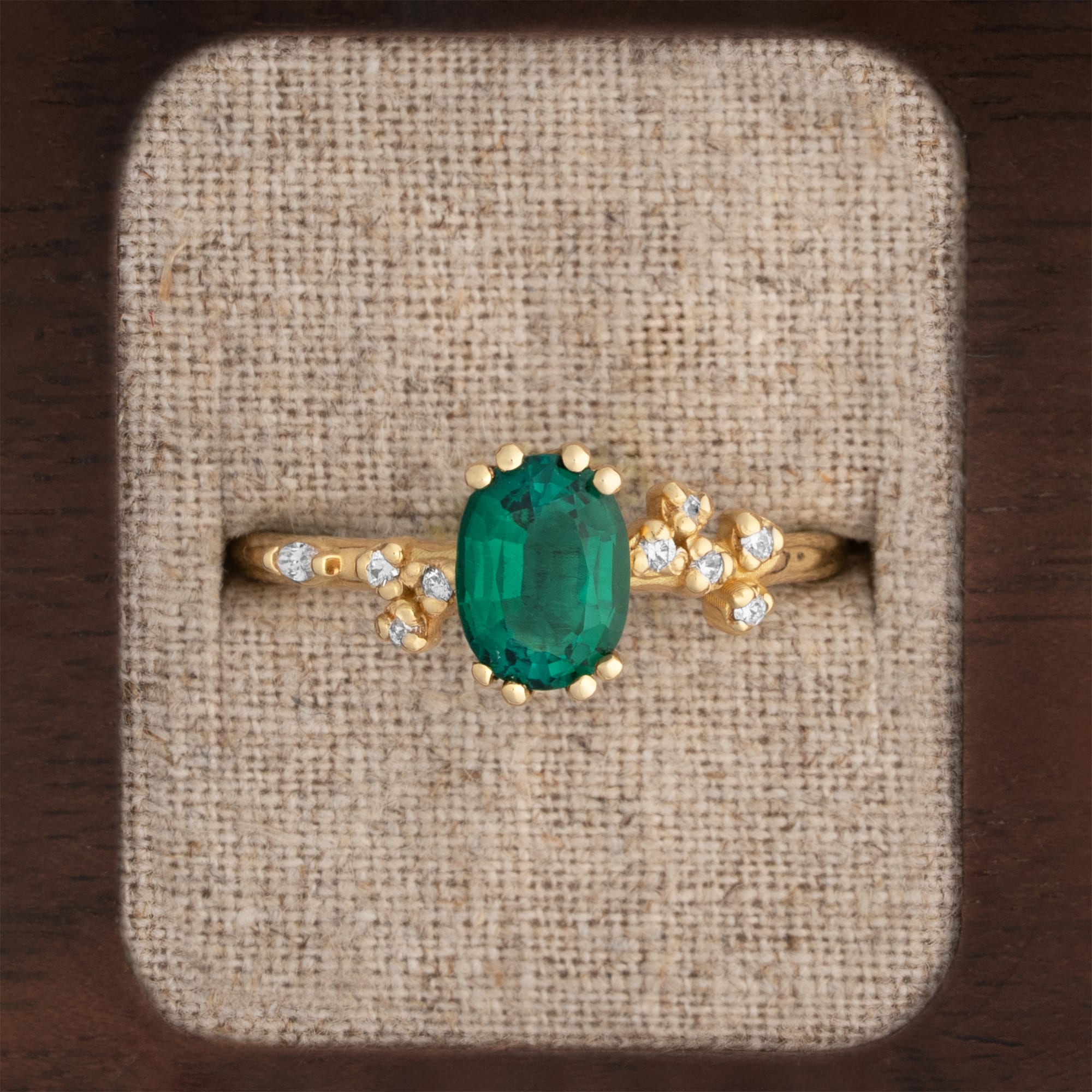 Oval cut lab emerald and diamond cherry blossom ring