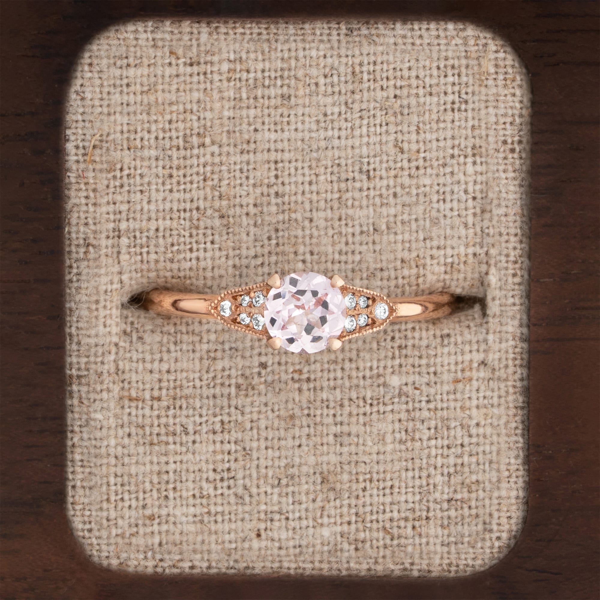 Pink champagne sapphire and diamond engagement ring 