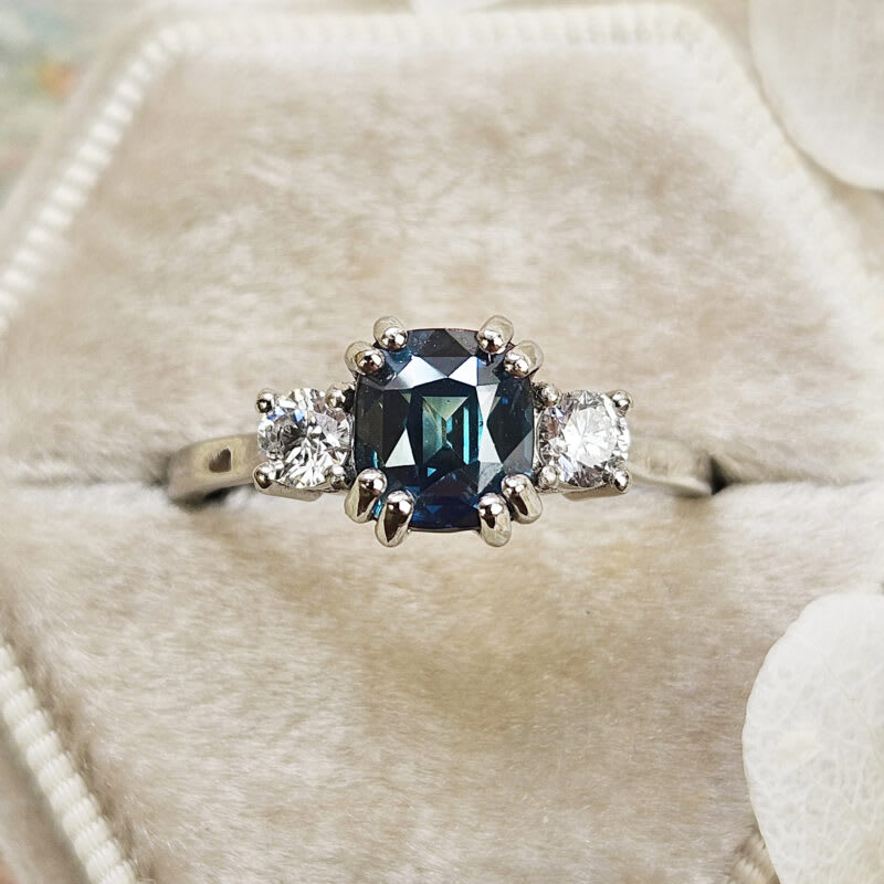 Cushion cut teal sapphire and diamond trilogy ring — 1