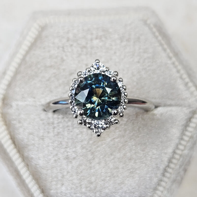 Parti sapphire and diamond halo engagement ring