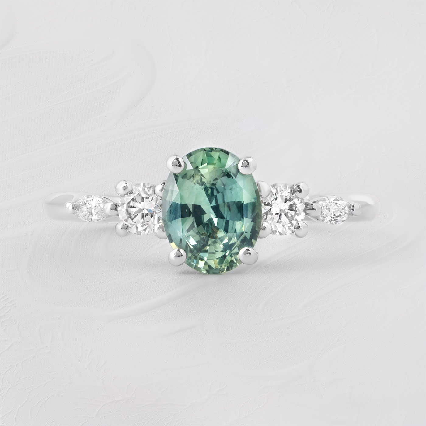 Oval teal sapphire and diamond trellis ring  — 1