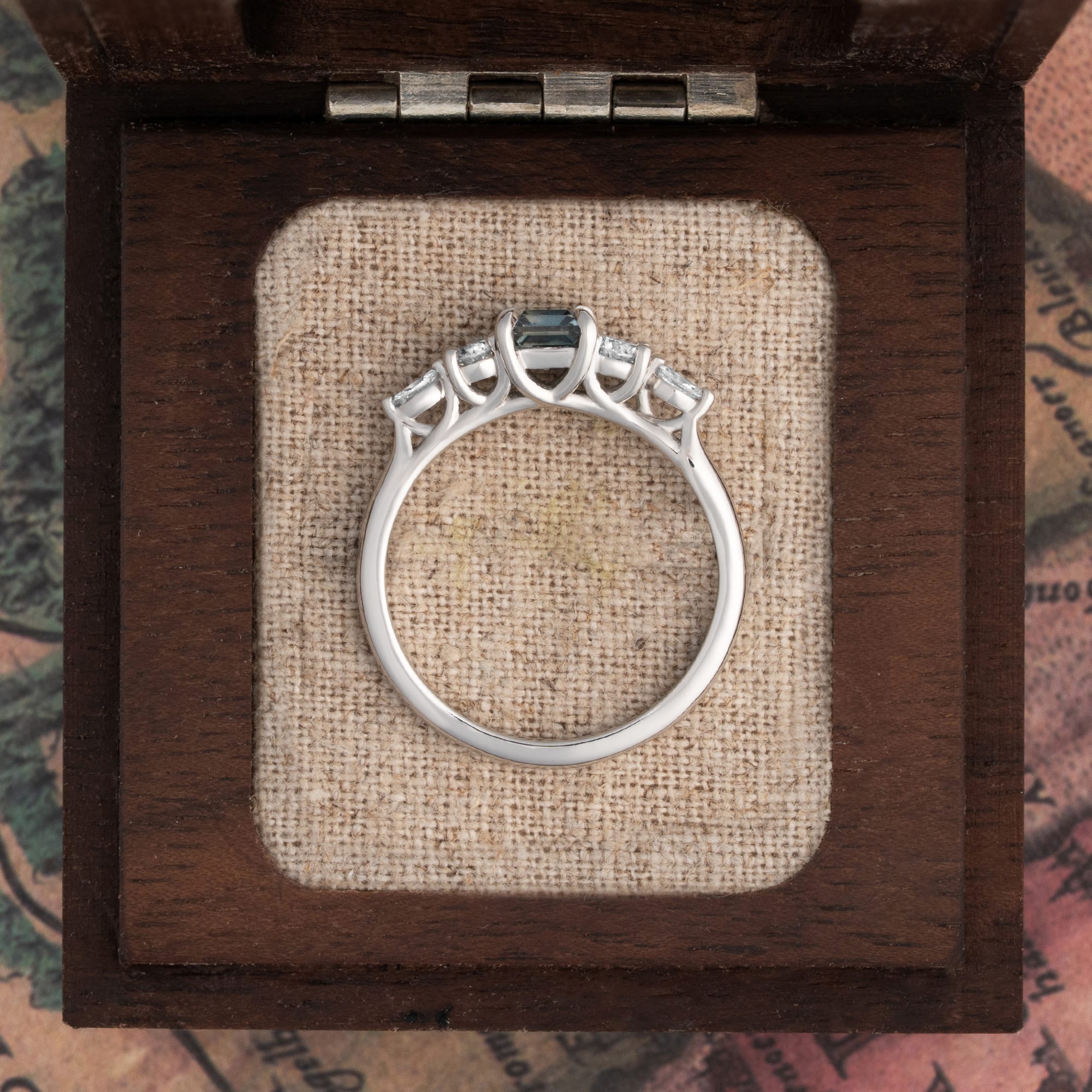 Emerald cut steely teal sapphire and diamond trellis ring  - alternate view