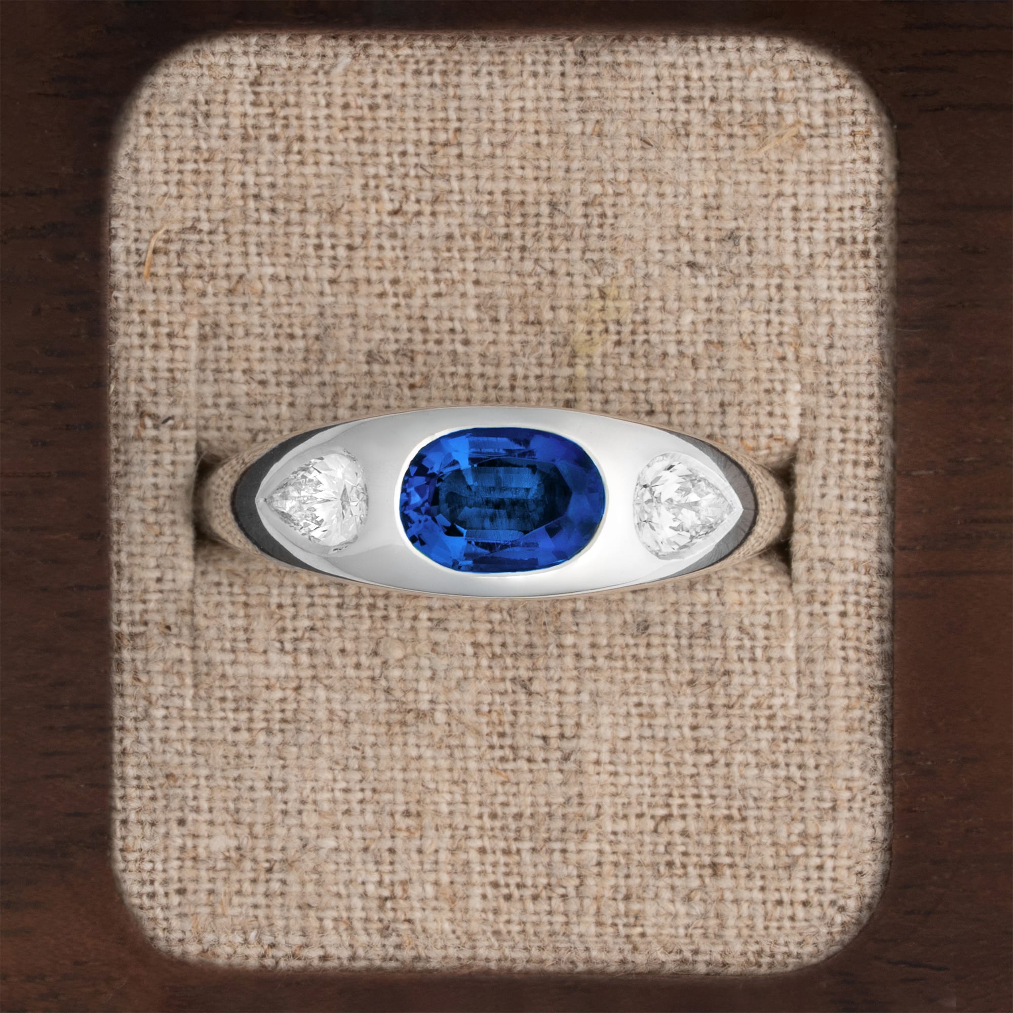 Lab sapphire and diamond bezel set ring 