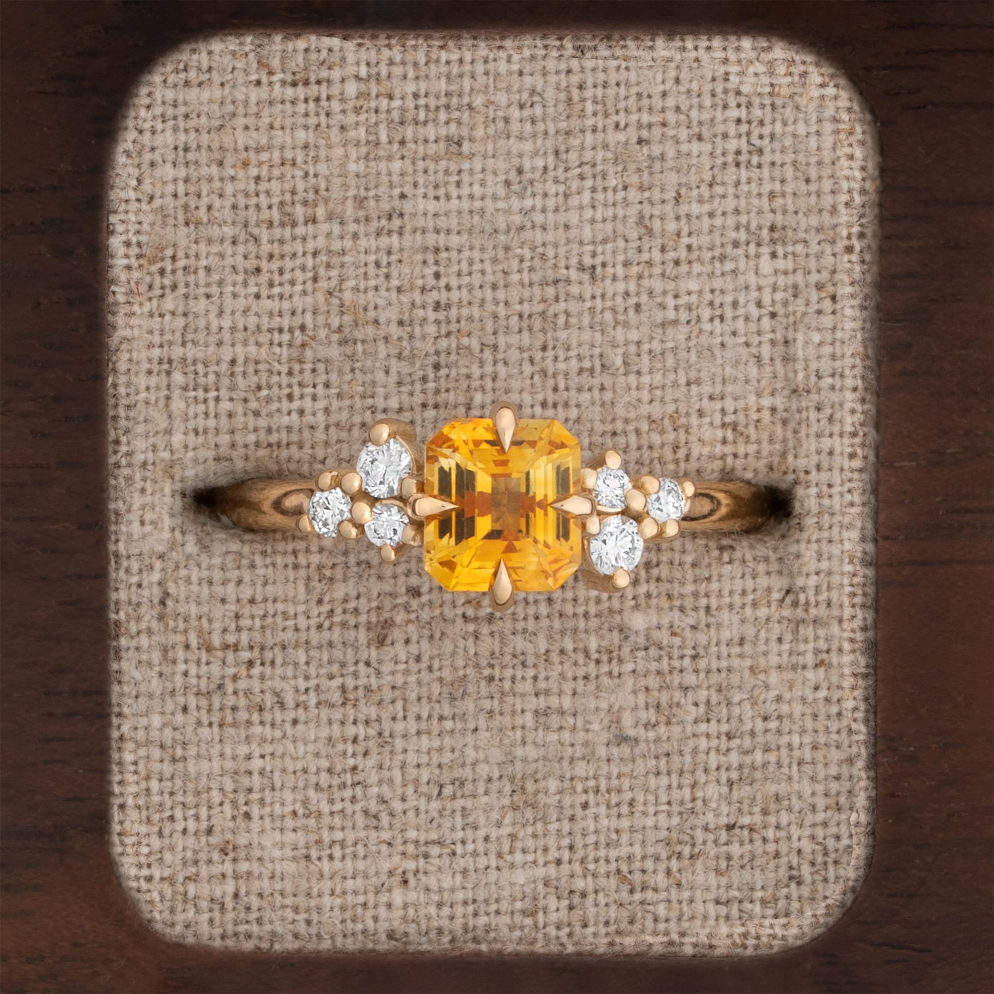 Golden yellow sapphire and diamond cluster ring