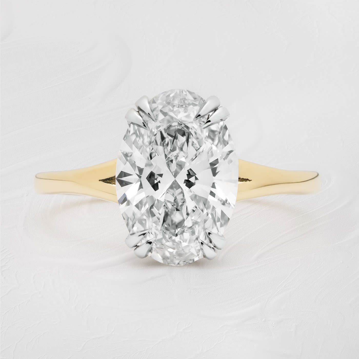 Oval lab grown diamond solitaire ring in platinum and yellow gold — 1