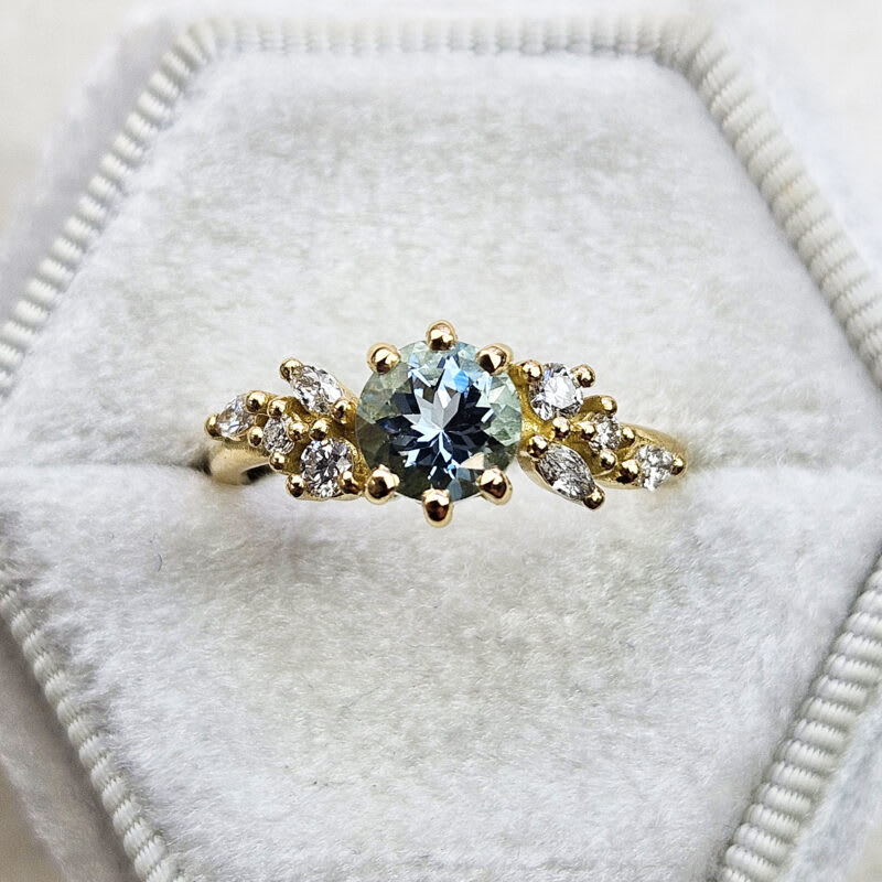 Aquamarine and diamond floral ring