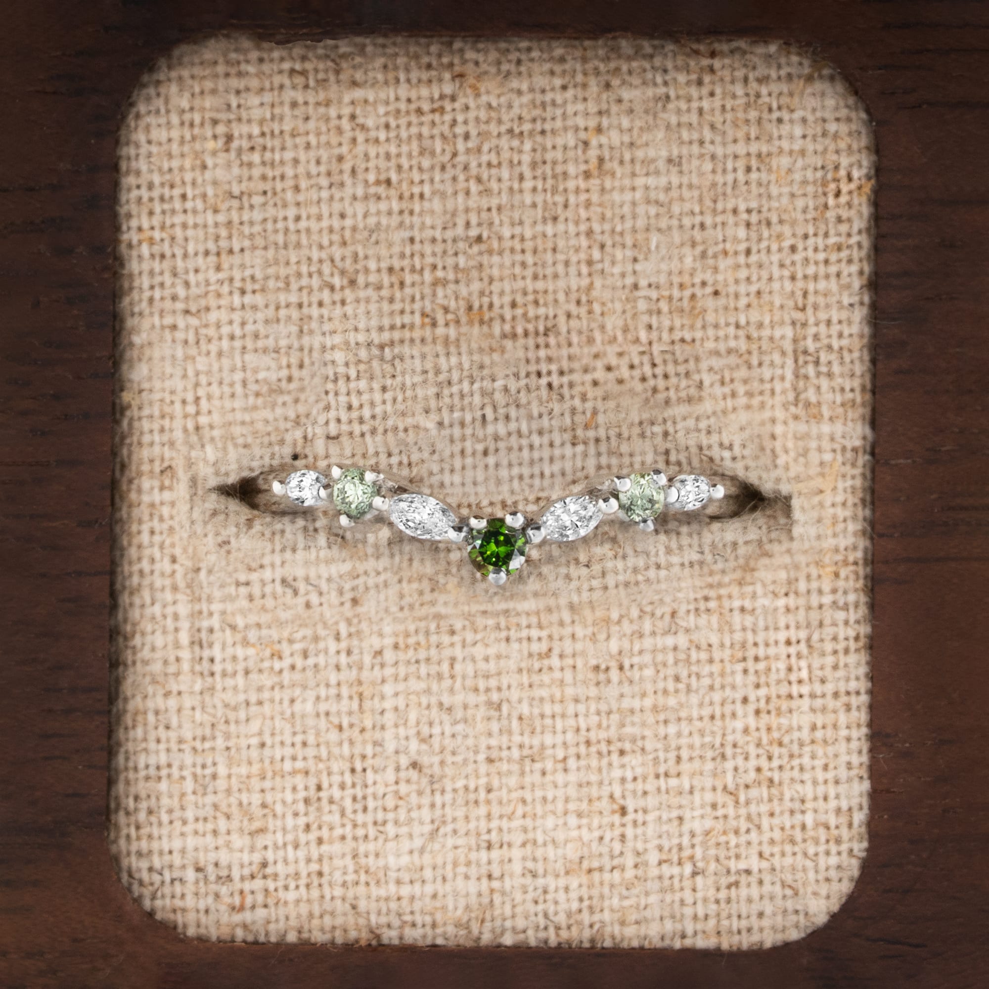 Shaped green and white diamond wedding band