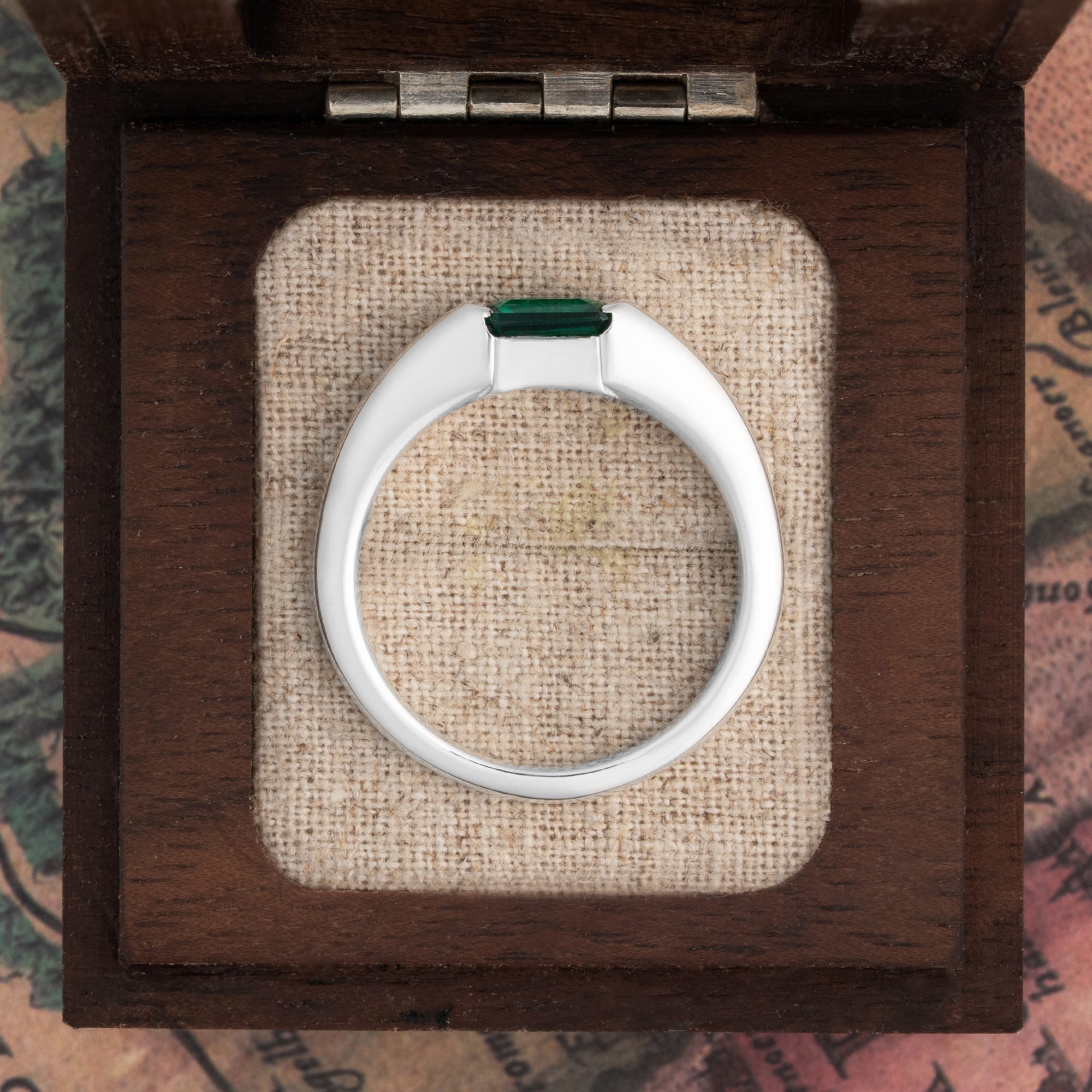 Channel set emerald tapered band — 8