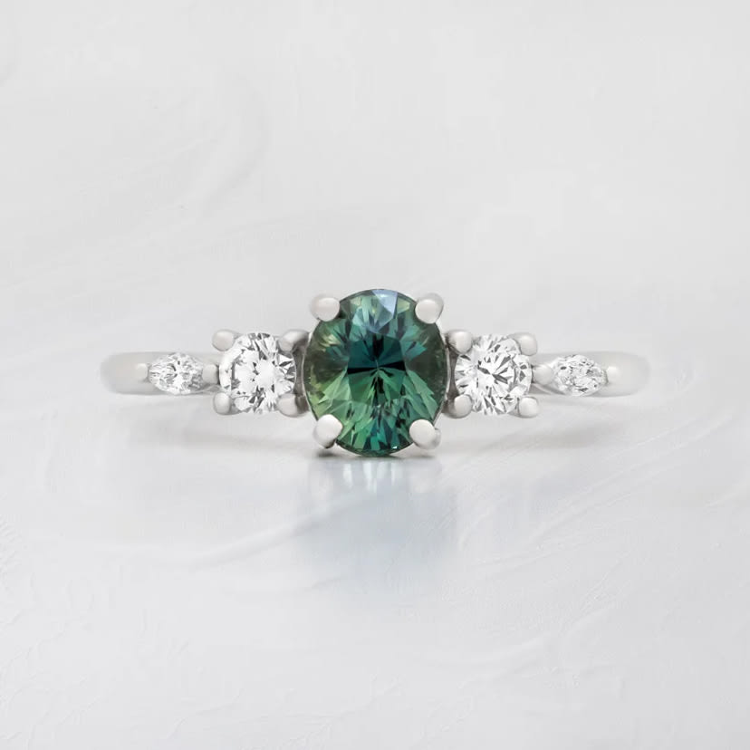 Oval teal sapphire and diamond ring — 1