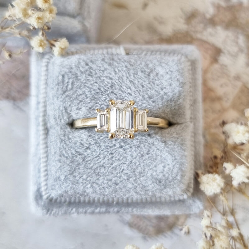 Emerald cut lab grown diamond trilogy ring — 1