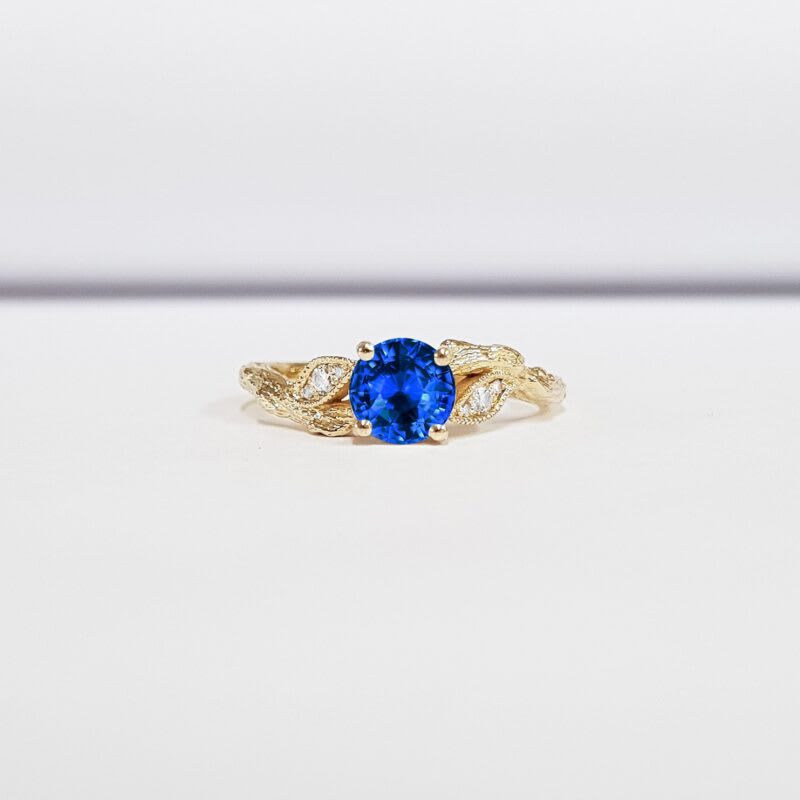 Lab blue sapphire and diamond nature engagement ring — 1