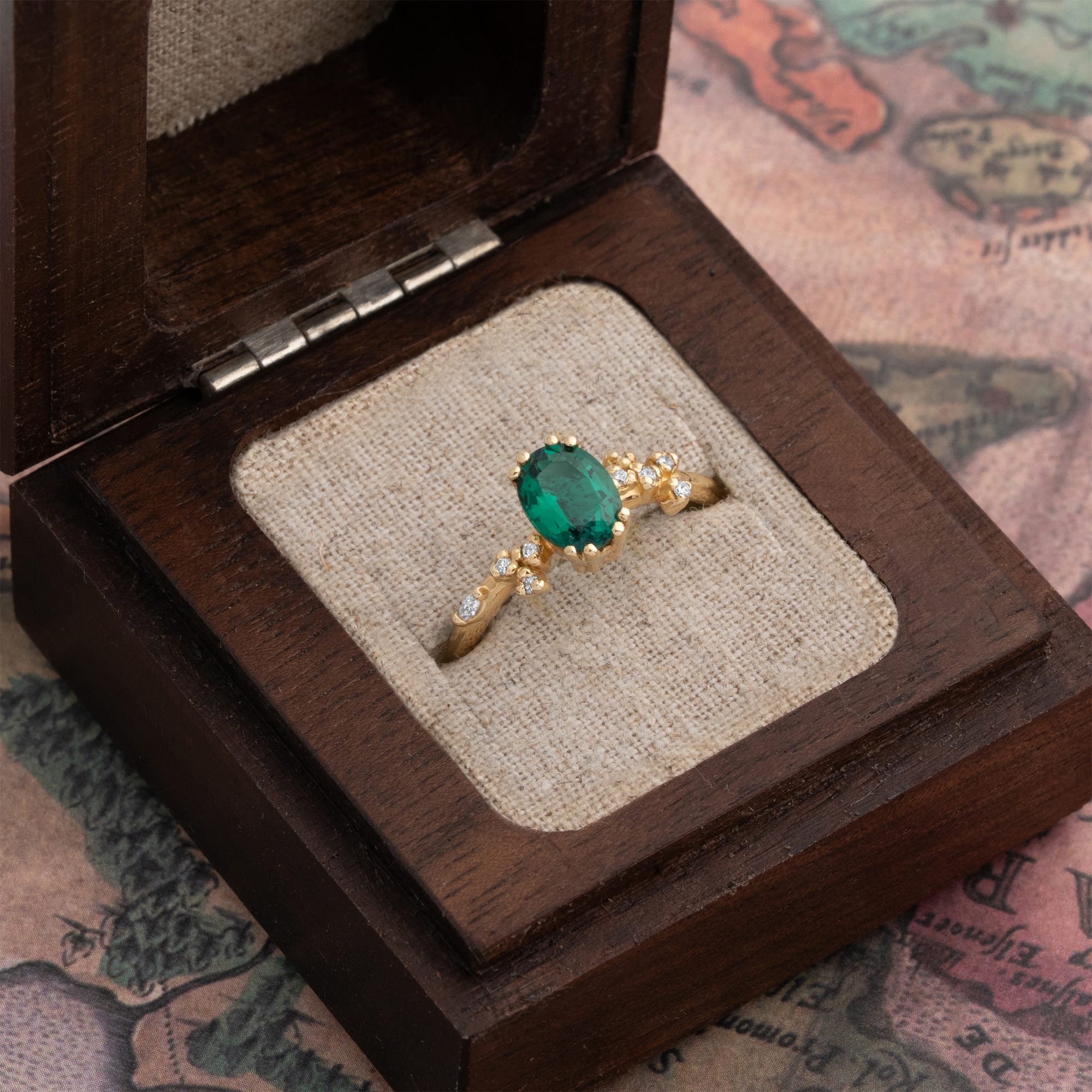 Oval cut lab emerald and diamond cherry blossom ring - alternate view