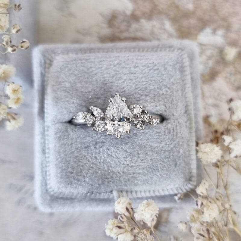 Pear cut lab grown diamond floral engagement ring in platinum