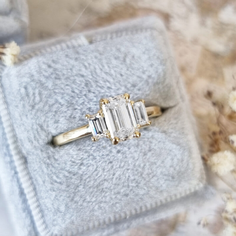 Emerald cut lab grown diamond trilogy ring — 2