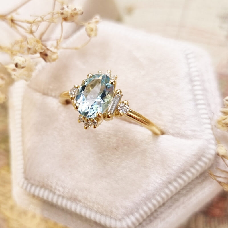 Oval aquamarine and diamond cluster ring in 18ct yellow gold - alternate view