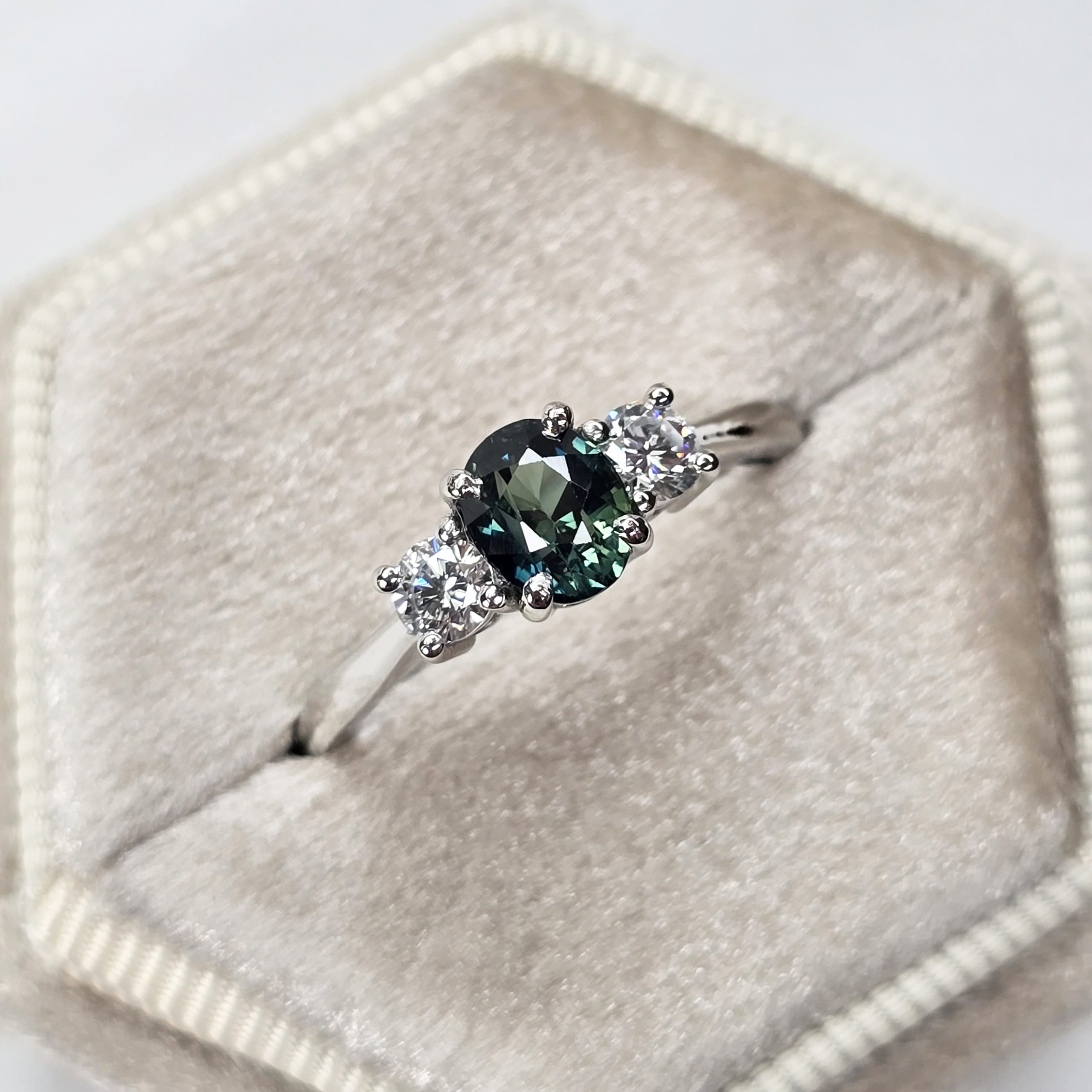 Cushion cut teal sapphire and diamond trilogy ring — 1