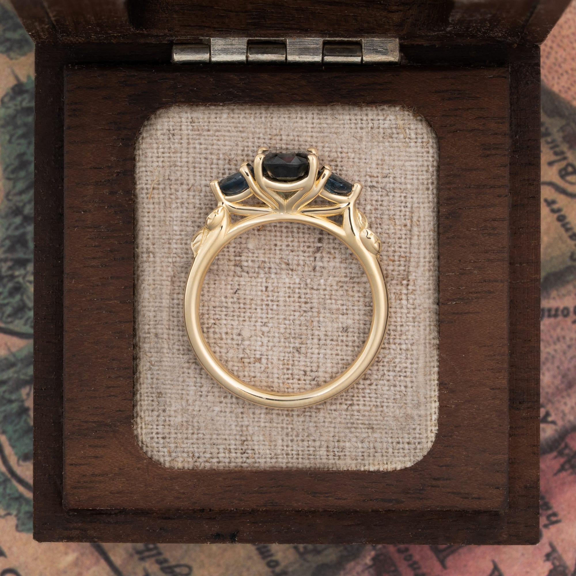 Teal sapphire trilogy ring — 2