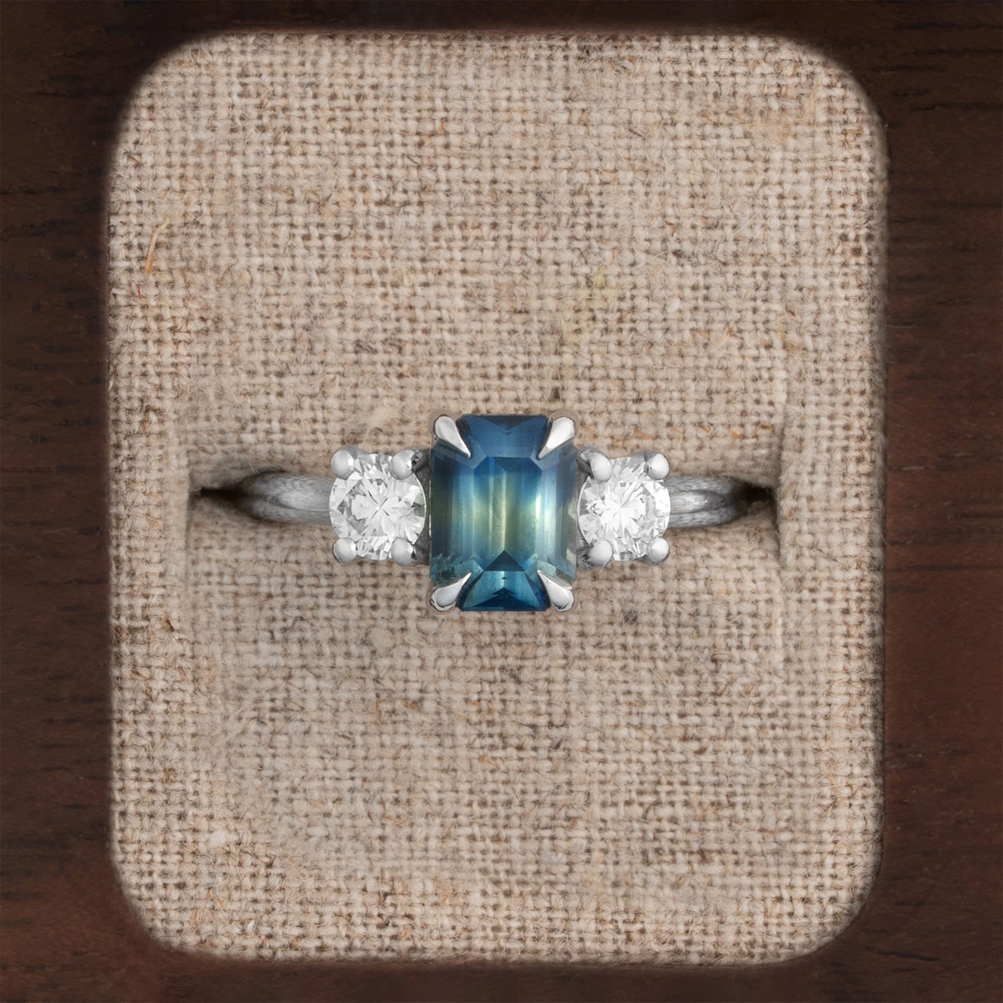Bi colour emerald cut sapphire and diamond ring