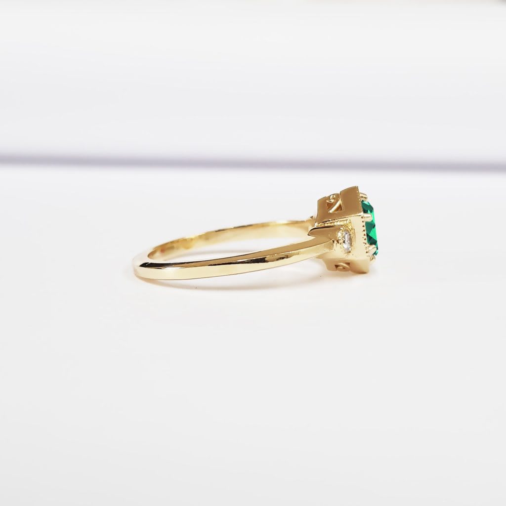 Teal green moissanite trilogy ring — 2