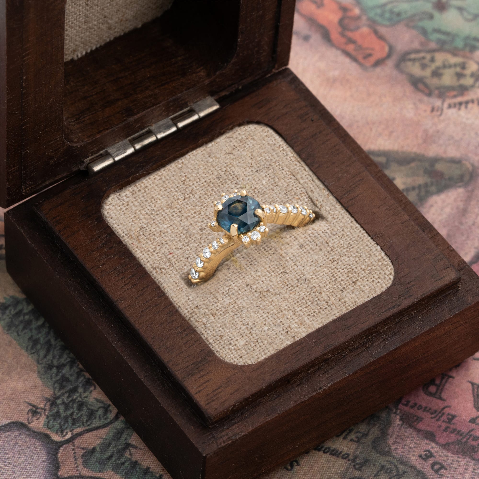 Intense precision cut deep teal sapphire and diamond twist ring — 3