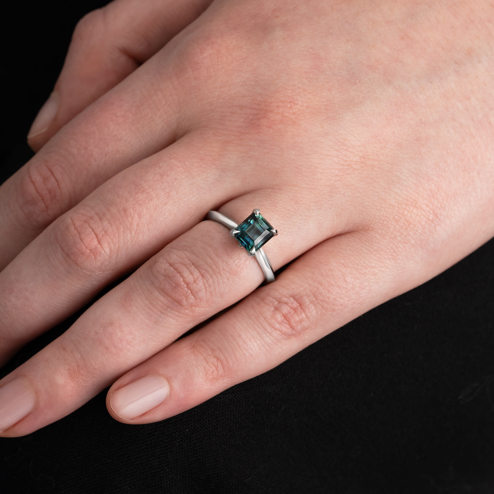 Emerald cut teal sapphire solitaire ring - alternate view