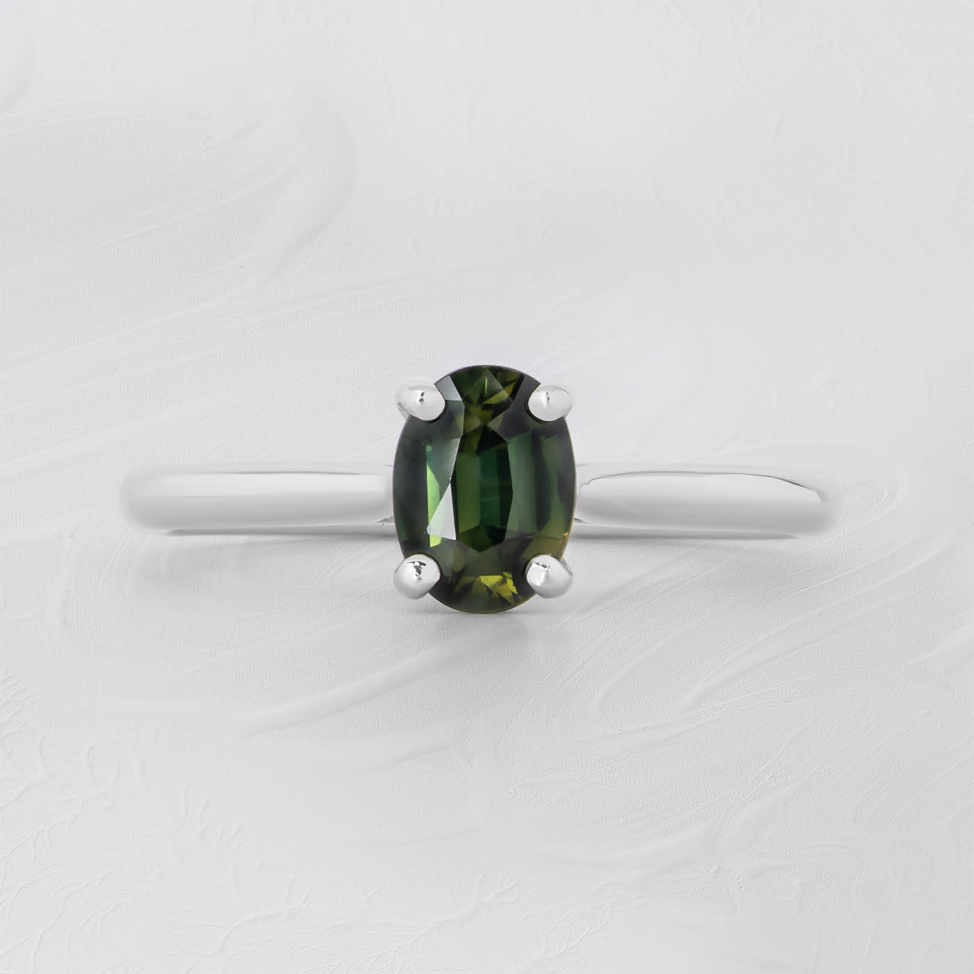Oval teal sapphire solitaire 