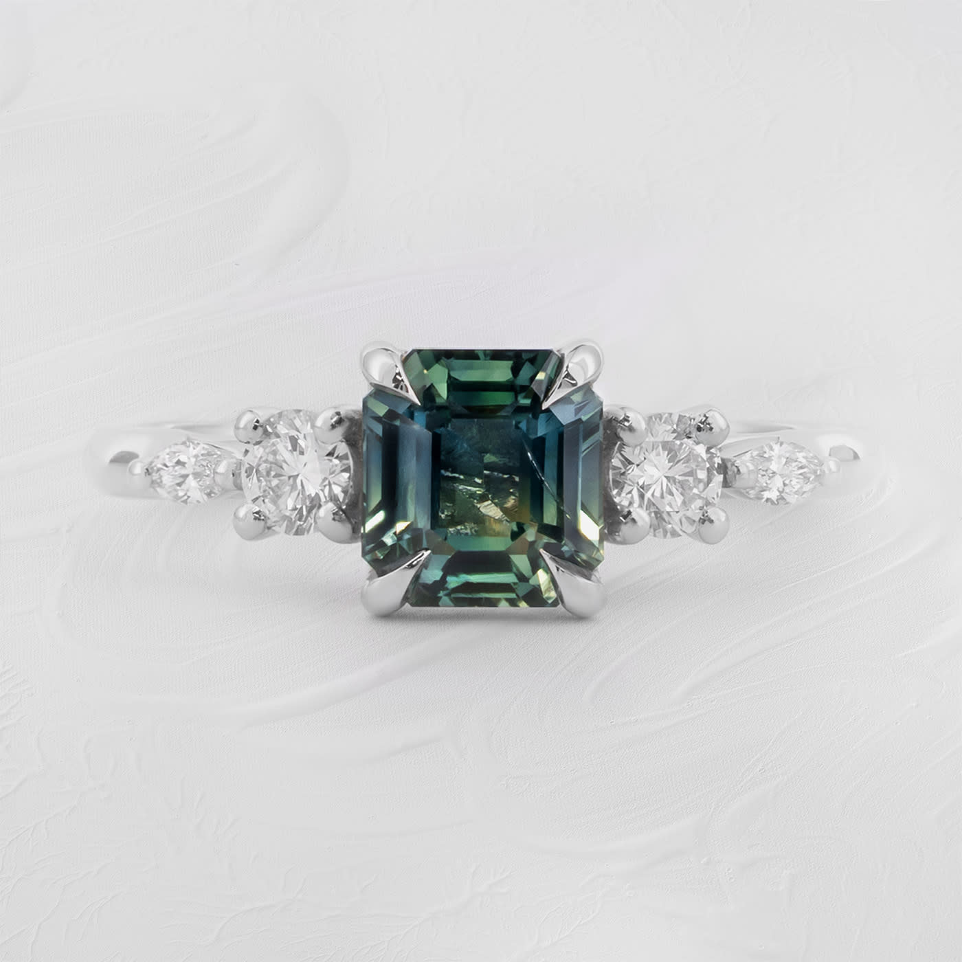 Emerald cut teal sapphire and diamond trellis ring  — 1