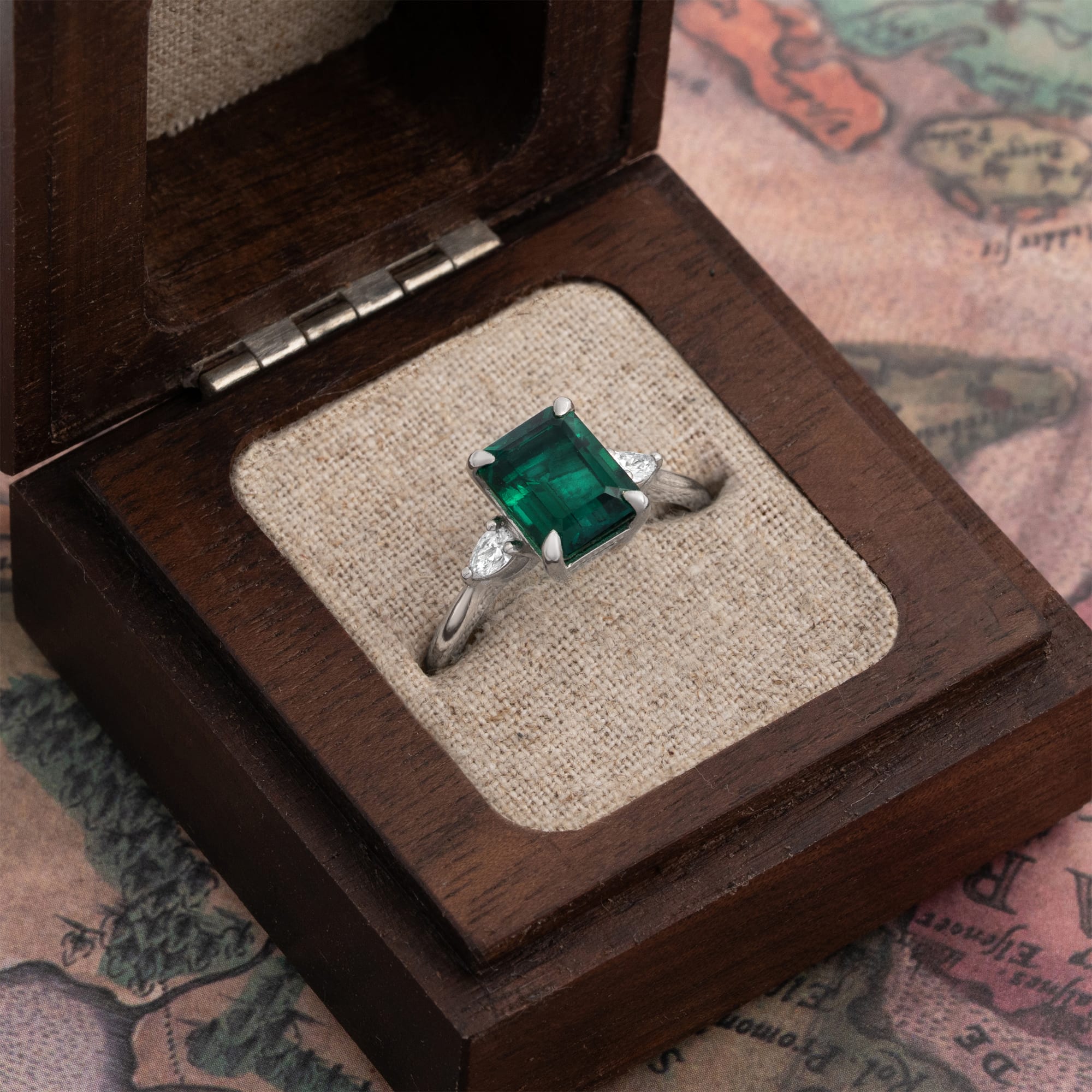 Emerald and lab diamond trilogy ring — 2