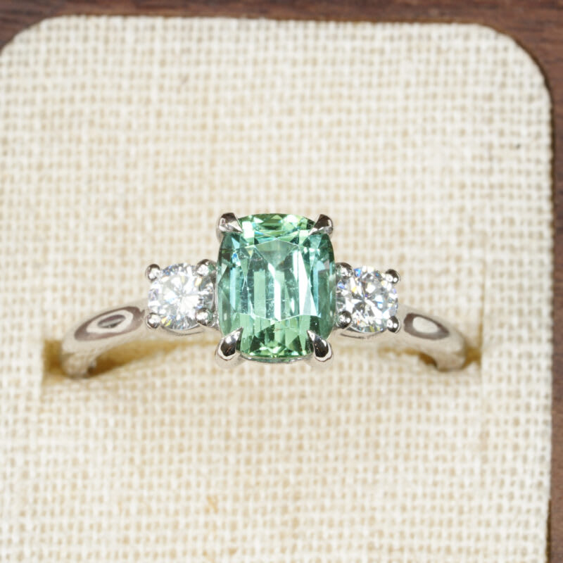 Cushion cut mint tourmaline and diamond trilogy ring — 1