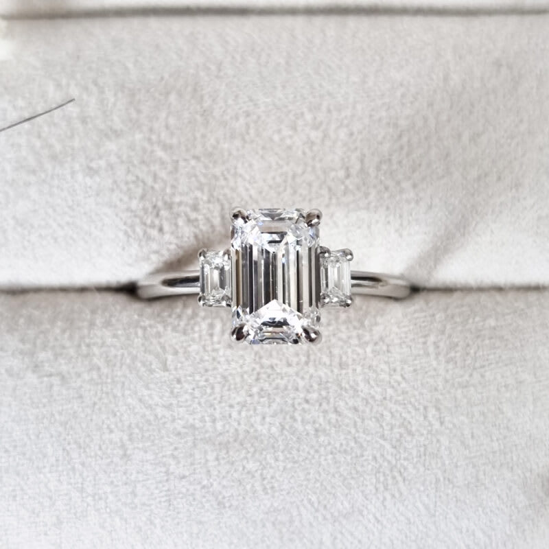 Emerald cut lab grown diamond trilogy ring — 1