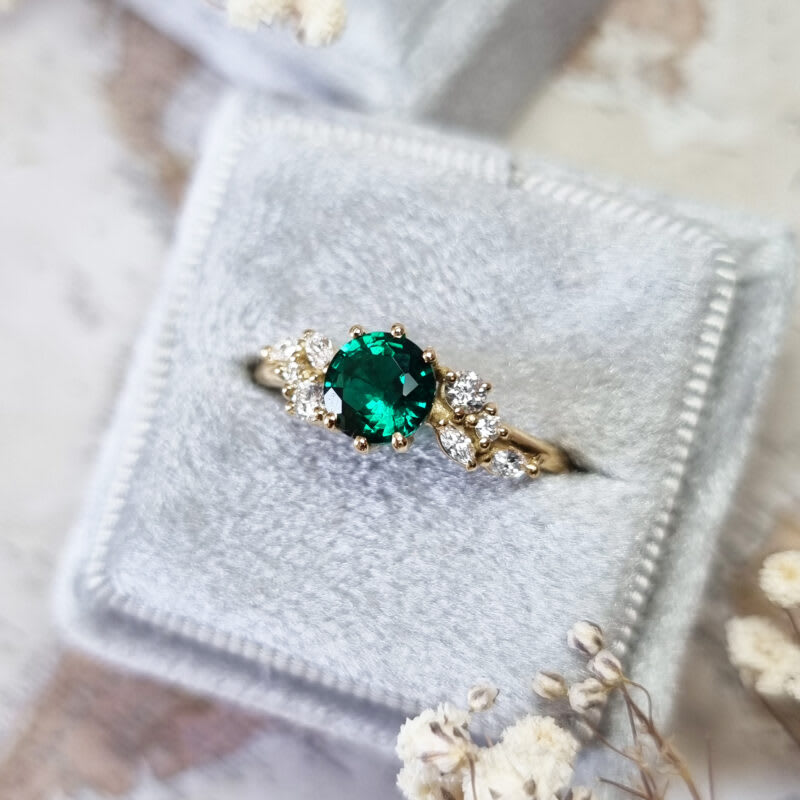 Round emerald and diamond cluster ring — 5