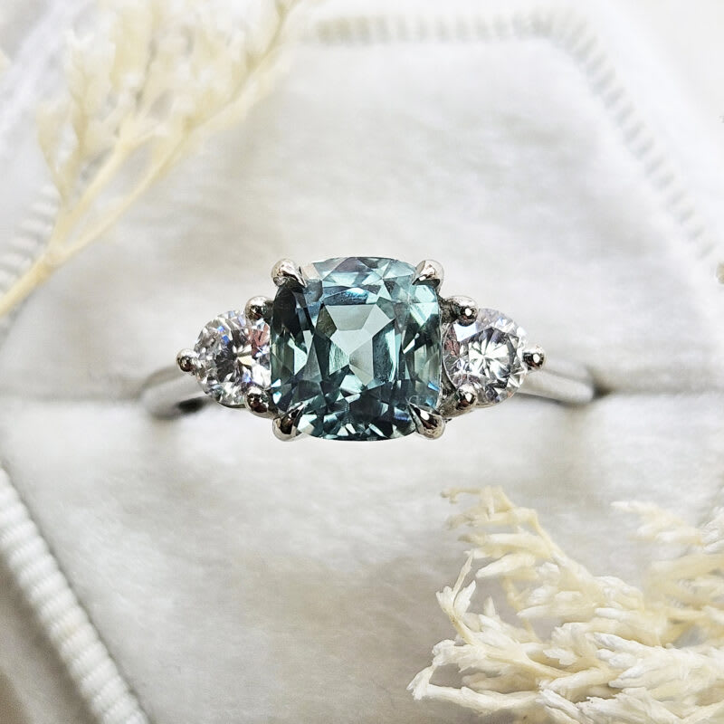 Cushion cut icy blue tourmaline and diamond trilogy ring — 1