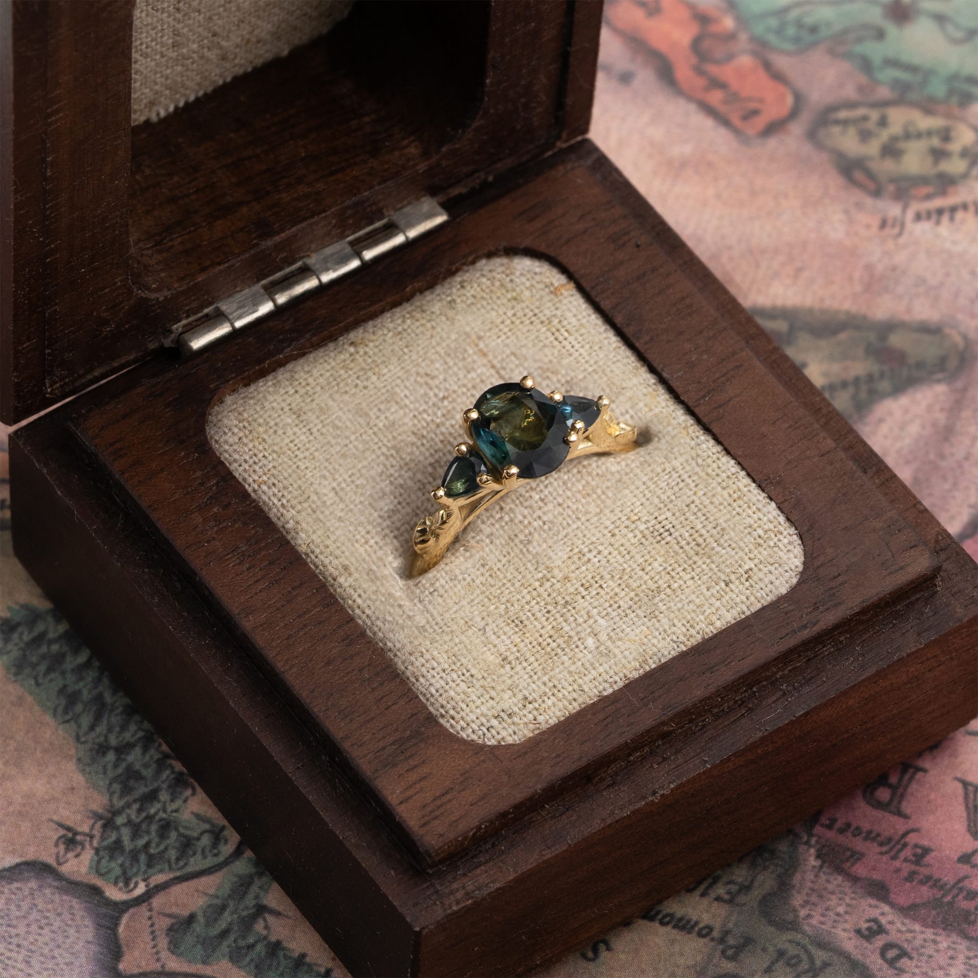 Teal sapphire trilogy ring — 3