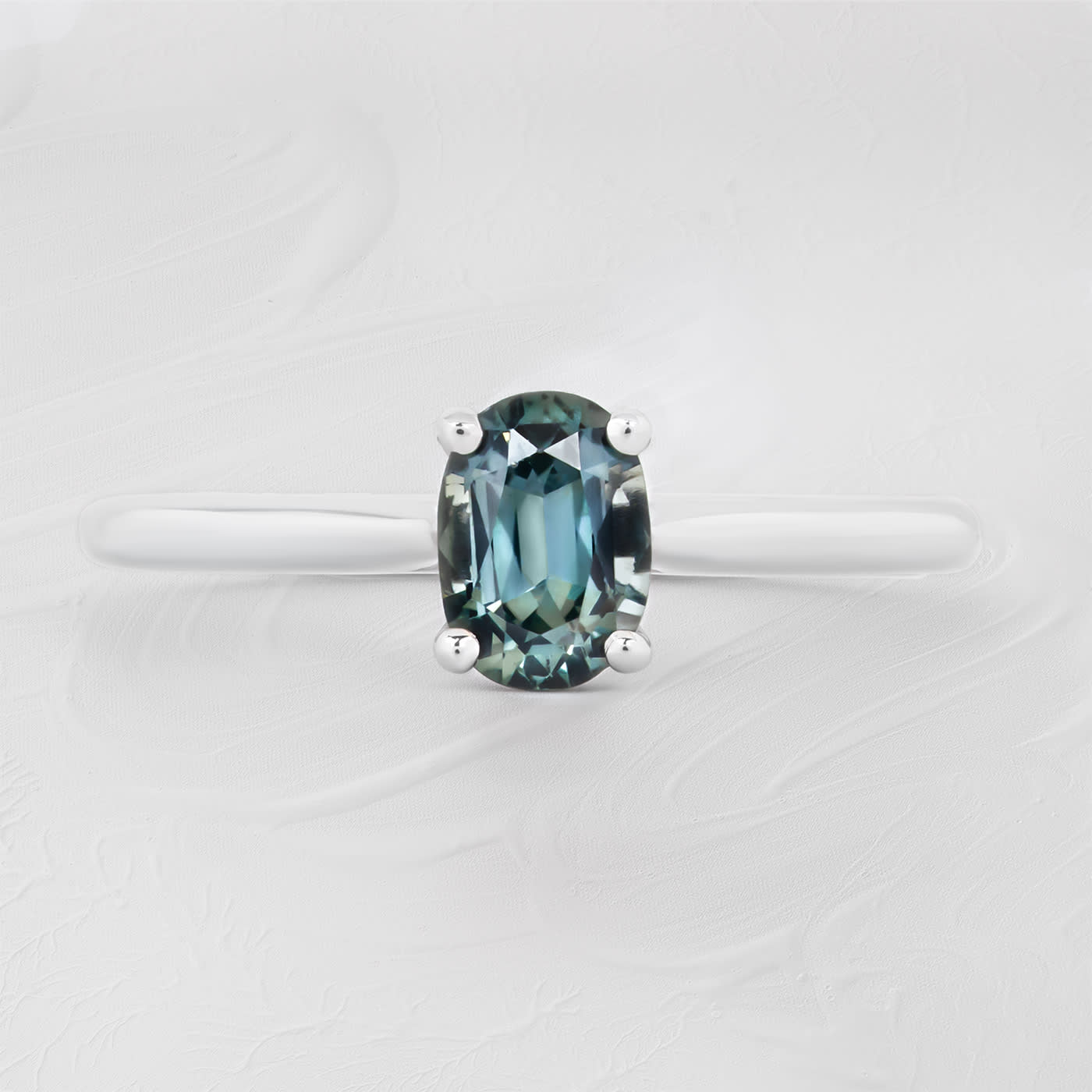 Oval teal sapphire solitaire  — 1