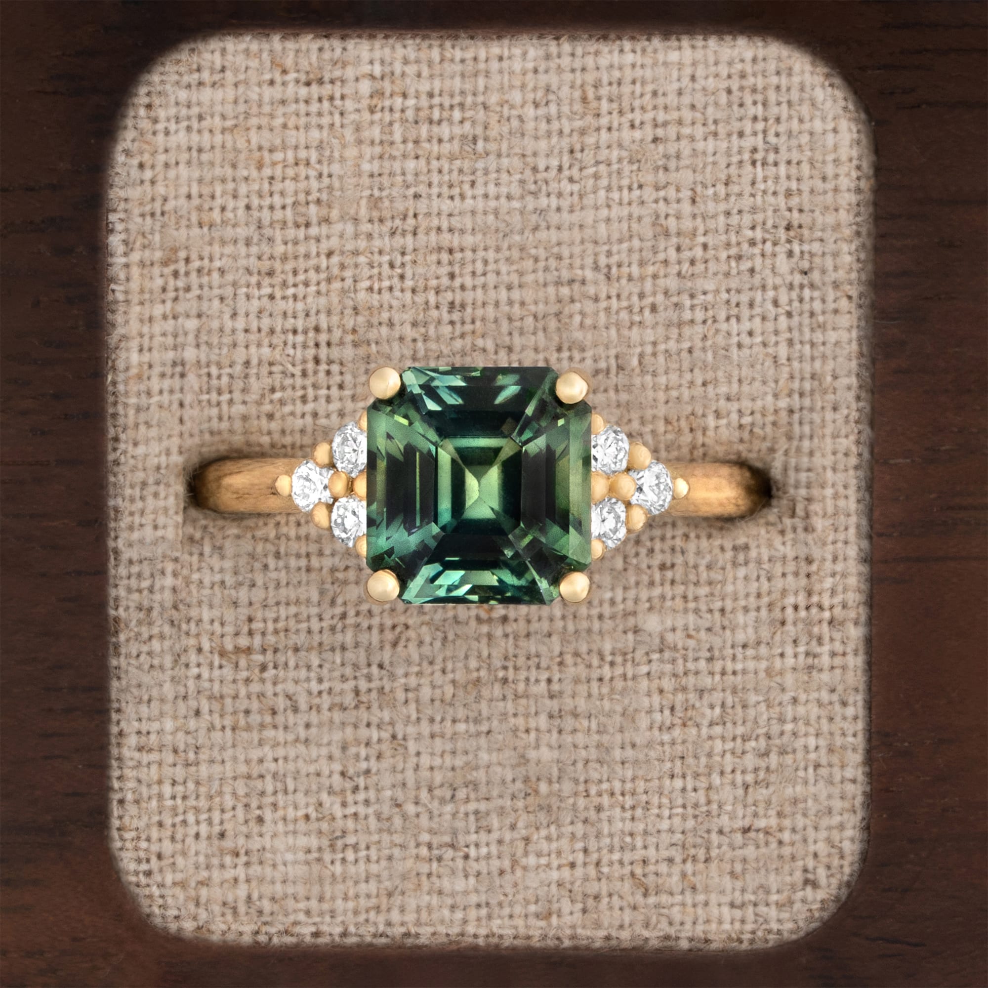 Emerald cut green sapphire and diamond ring