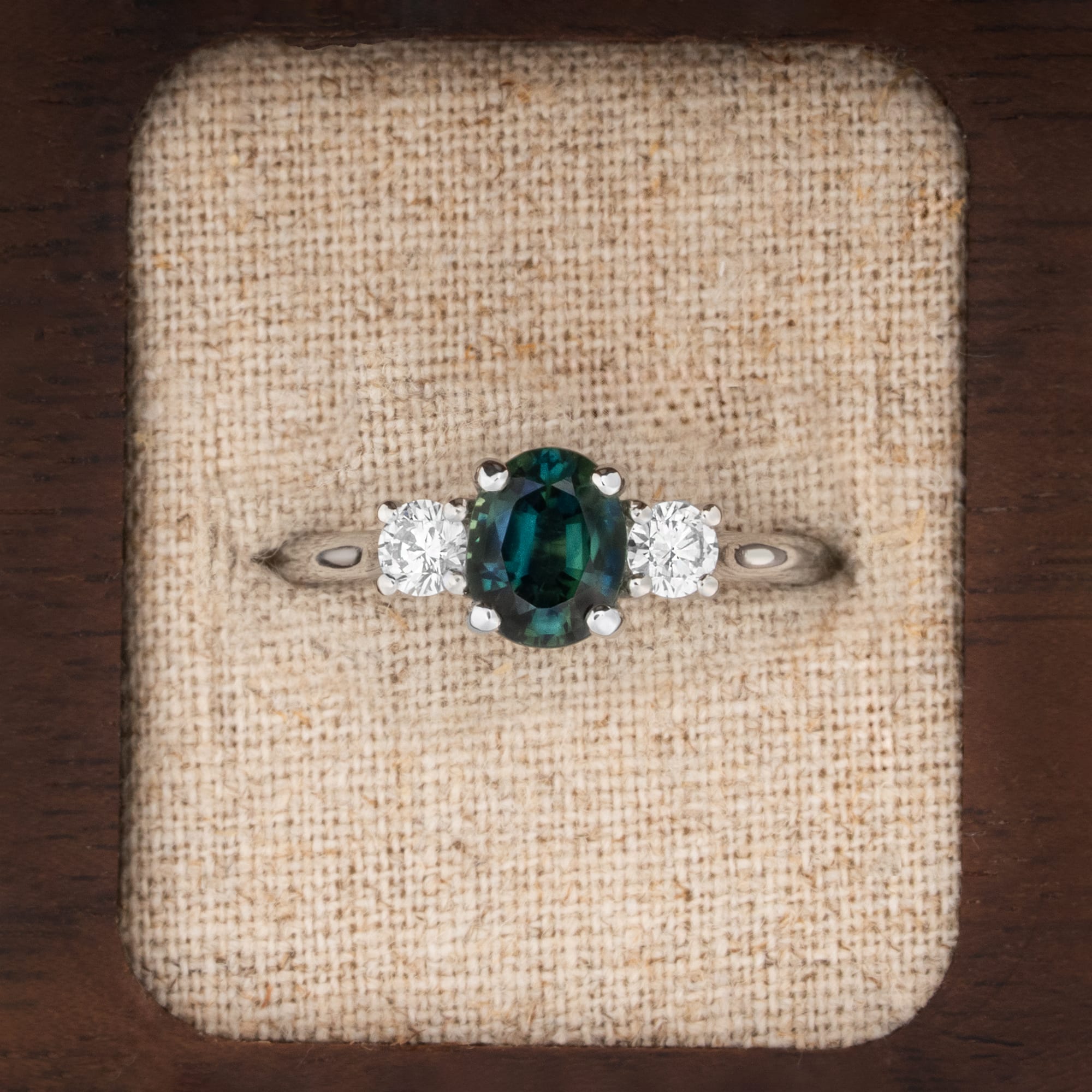 Teal sapphire and diamond trilogy ring