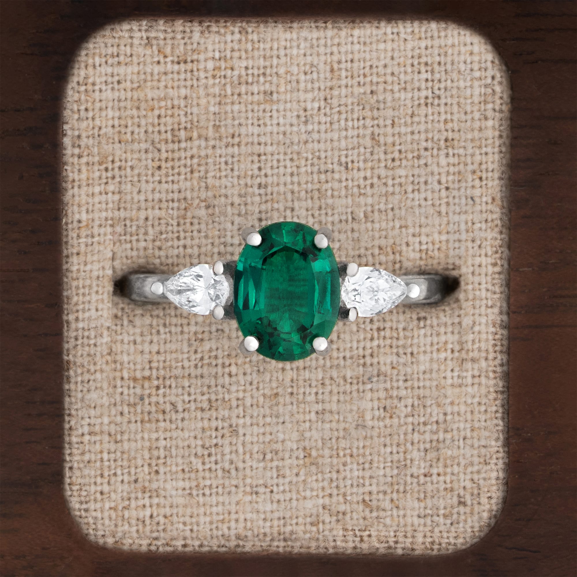 Lab grown oval emerald and pear diamond ring