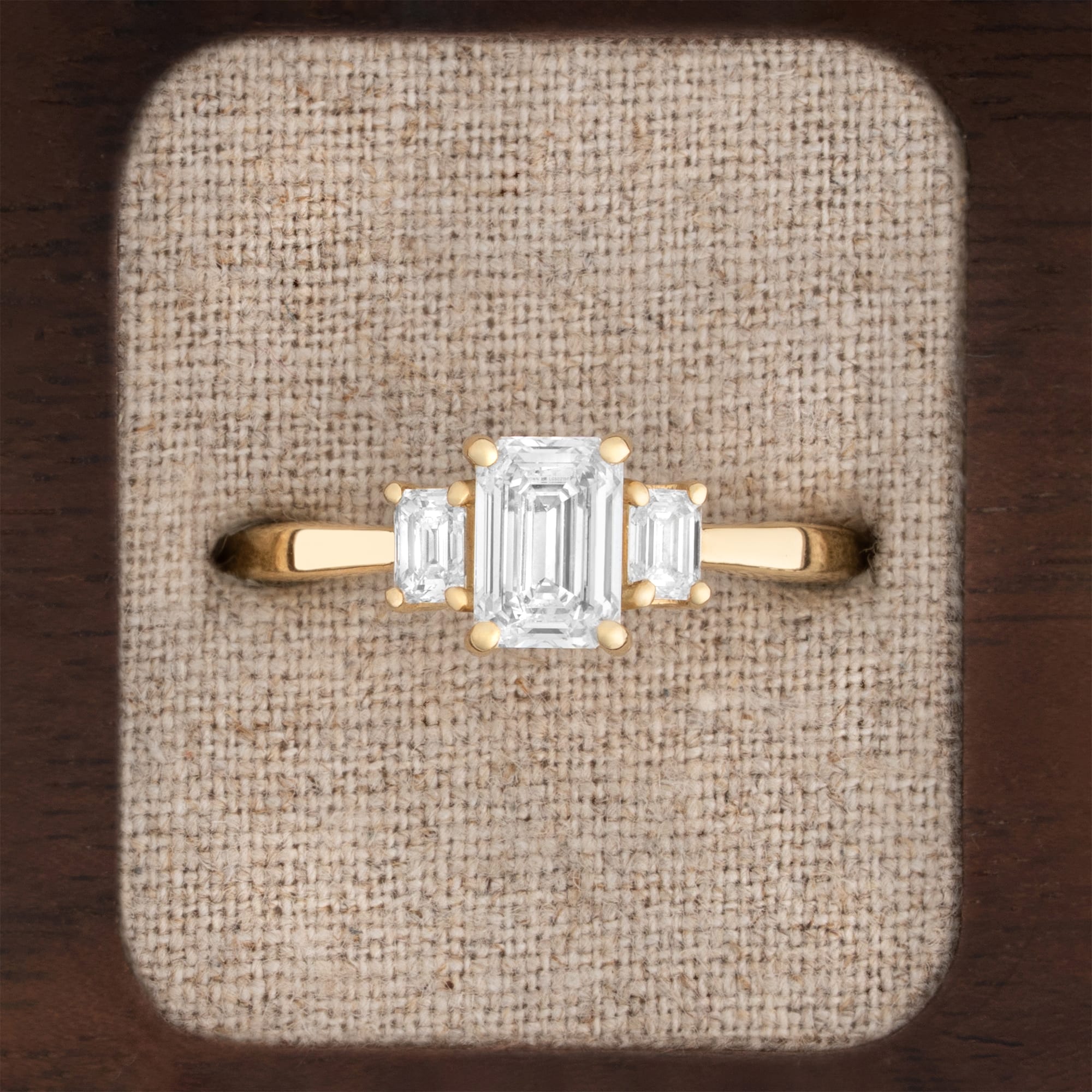 Emerald cut lab grown diamond trilogy ring