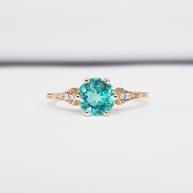 Mint sapphire and diamond engagement ring 