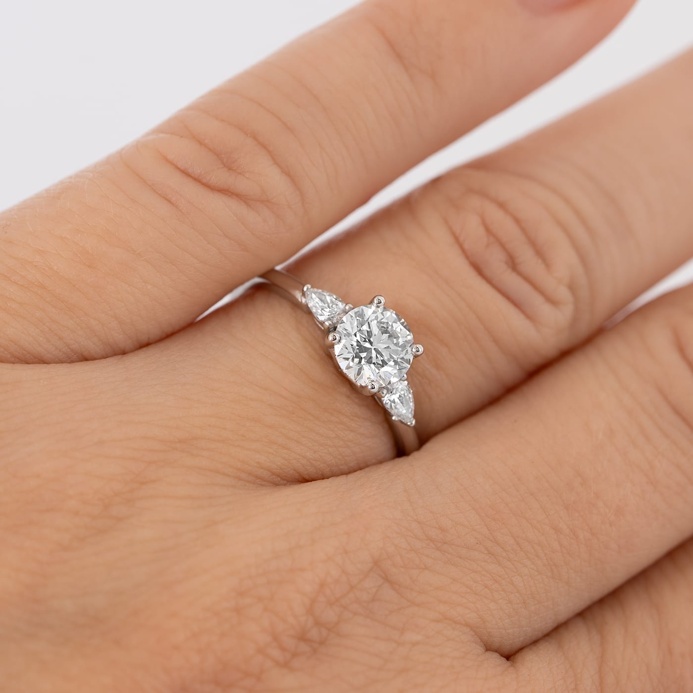Round and pear lab grown diamond trilogy ring  — 4