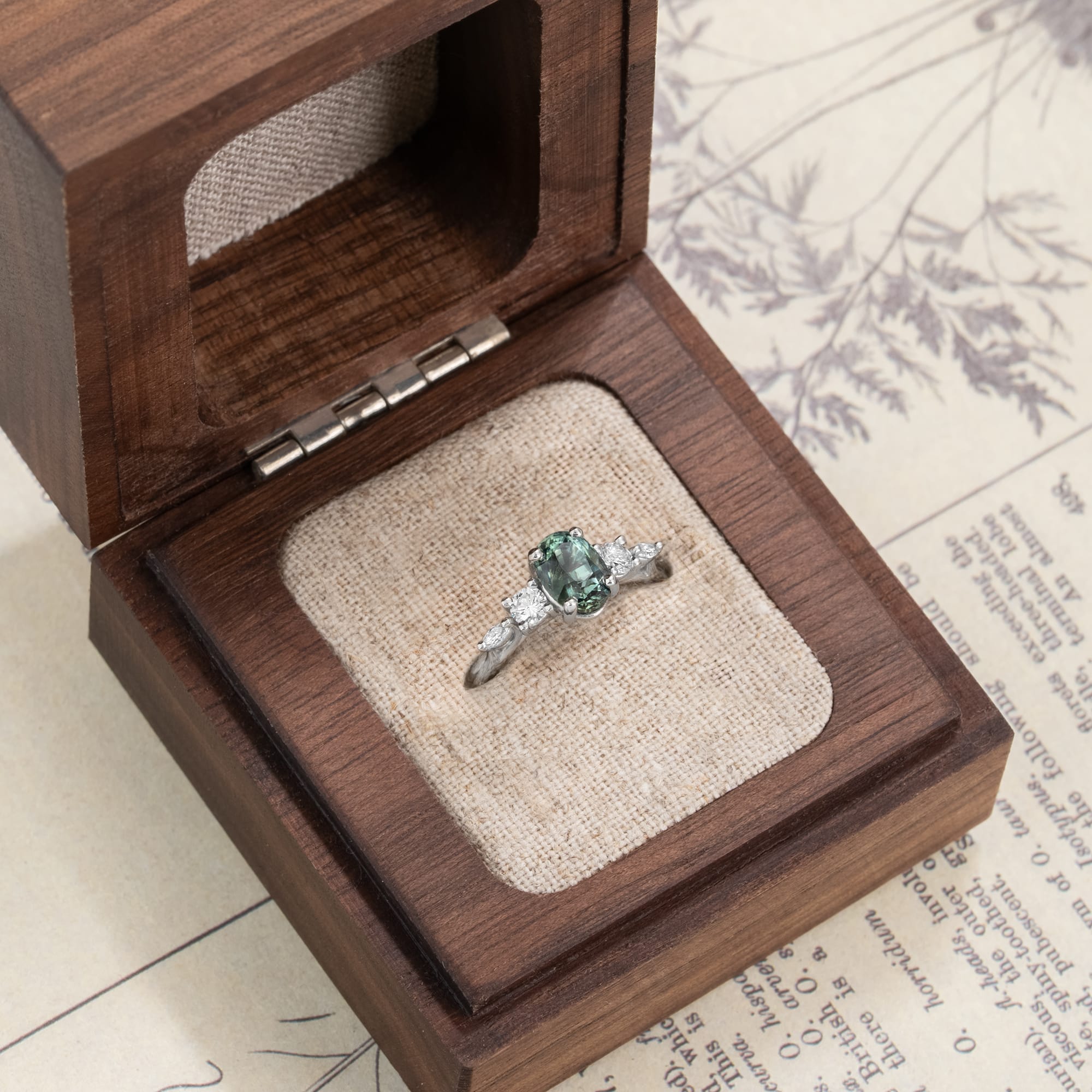 Oval teal sapphire and diamond trellis ring  — 2
