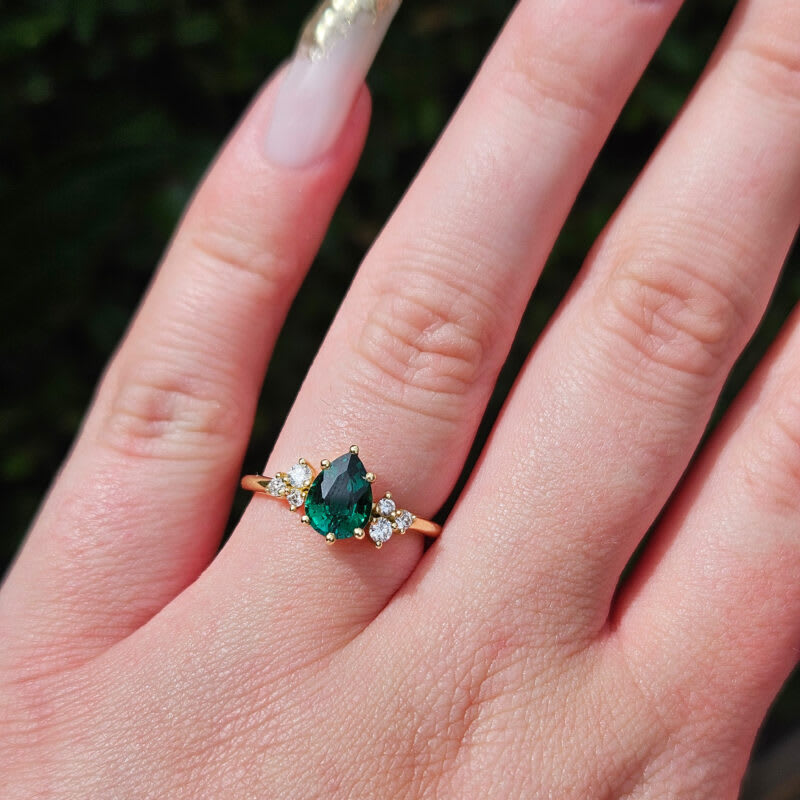 Pear lab grown emerald and diamond cluster ring in 18ct yellow gold - alternate view