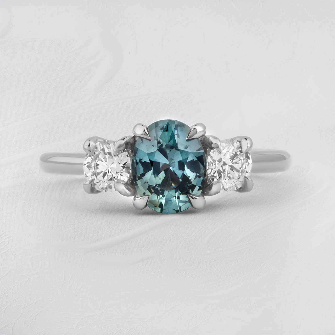 Ocean teal sapphire and diamond trilogy ring