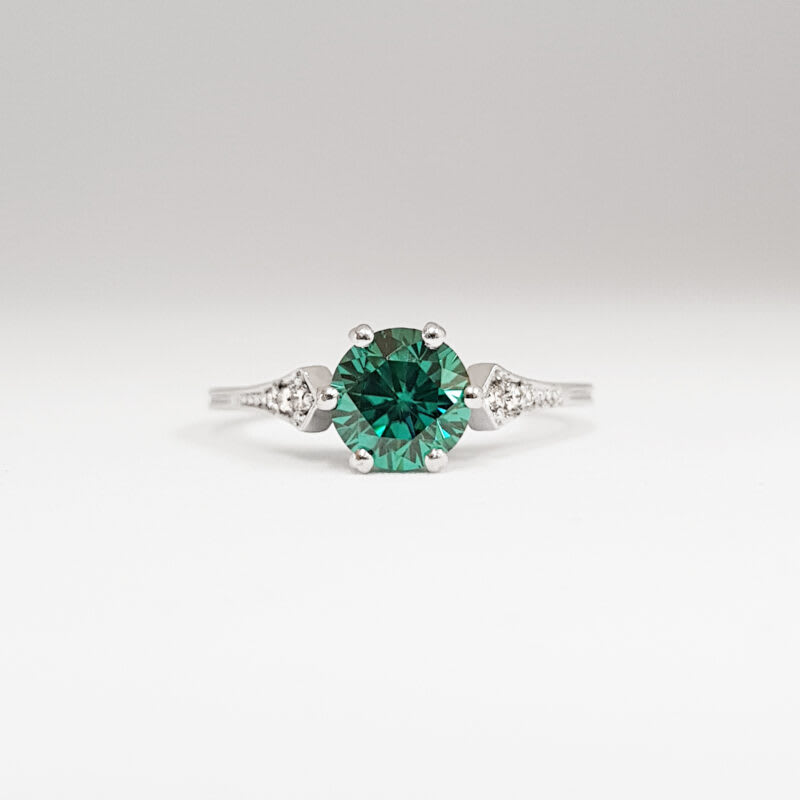 Teal moissanite and diamond engagement ring
